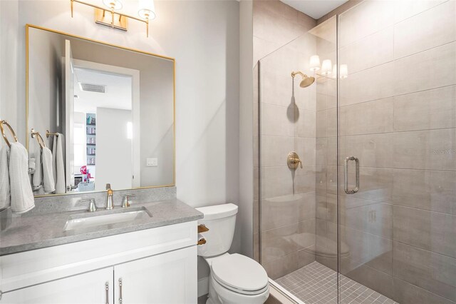 8209 Redonda Loop, Lakewood Ranch, FL 34202 - bathroom featuring visible vents, toilet, vanity, and a shower stall