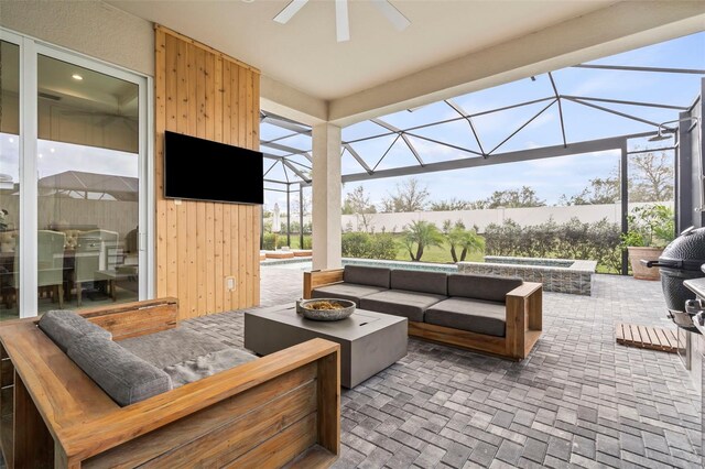 8209 Redonda Loop, Lakewood Ranch, FL 34202 - view of patio with glass enclosure, ceiling fan, and an outdoor living space with a fire pit