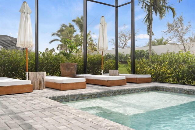 8209 Redonda Loop, Lakewood Ranch, FL 34202 - view of swimming pool with glass enclosure, a patio area, and a hot tub