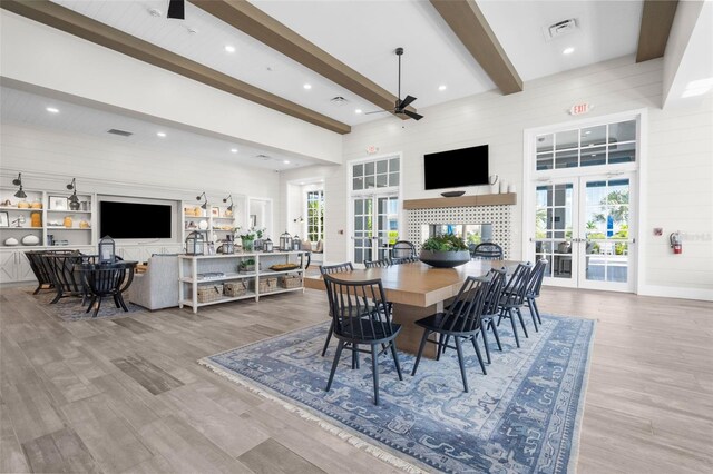 8209 Redonda Loop, Lakewood Ranch, FL 34202 - dining room featuring visible vents, a towering ceiling, a ceiling fan, beam ceiling, and french doors