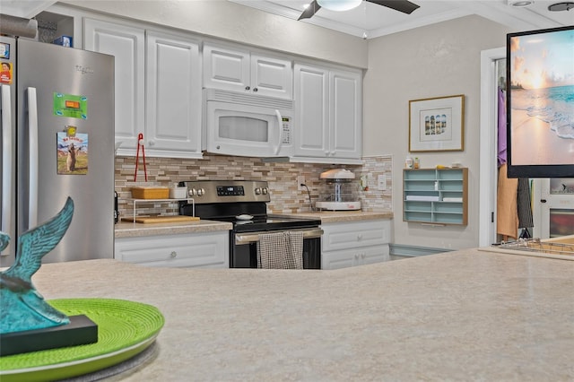 kitchen featuring appliances with stainless steel finishes, white cabinetry, backsplash, ceiling fan, and crown molding