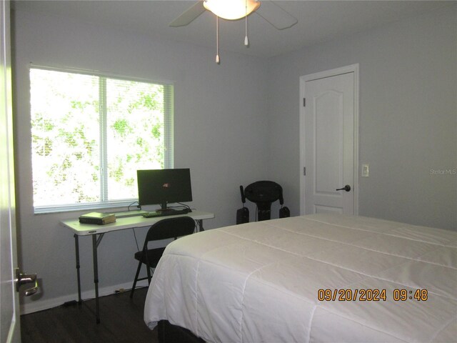 bedroom featuring ceiling fan and dark hardwood / wood-style flooring