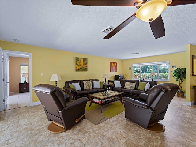 424 Baycrest Dr, Venice, FL 34285 - living room with a textured ceiling, a ceiling fan, and light tile patterned floors