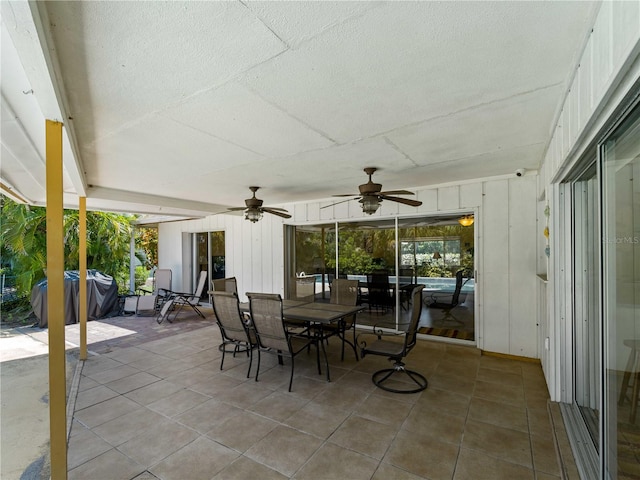 exterior space with area for grilling and ceiling fan