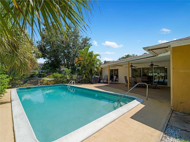 view of pool with ceiling fan and a patio area