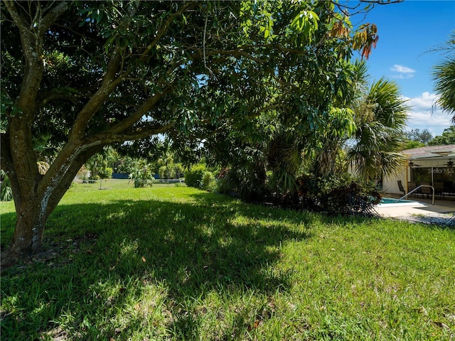 424 Baycrest Dr, Venice, FL 34285 - view of grassy yard with an outdoor pool and a patio
