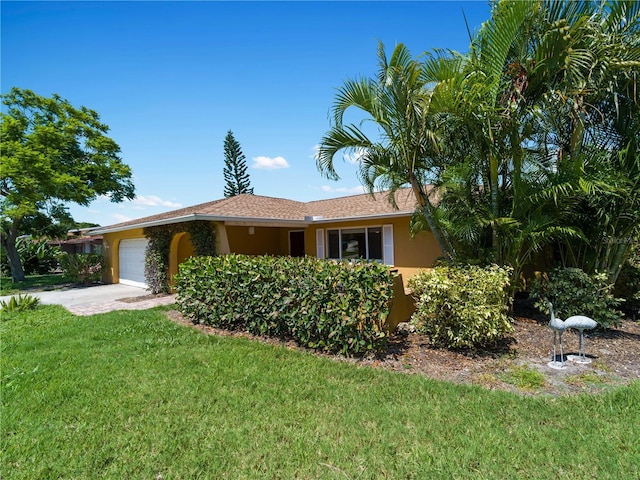 424 Baycrest Dr, Venice, FL 34285 - ranch-style house with stucco siding, an attached garage, a front yard, and concrete driveway