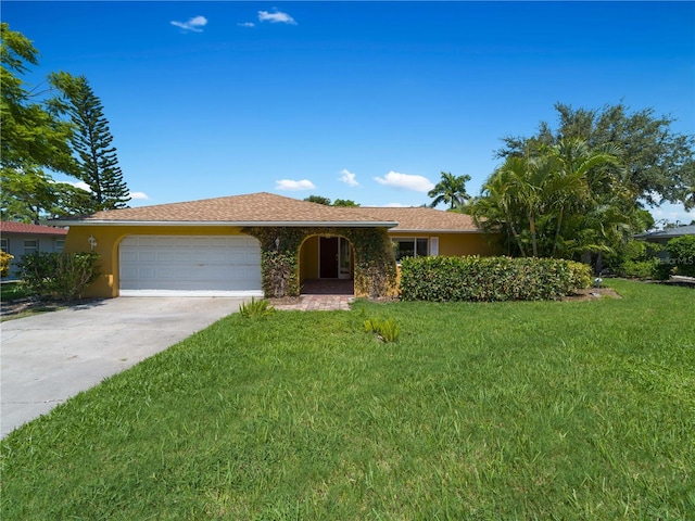 ranch-style home with a front yard and a garage