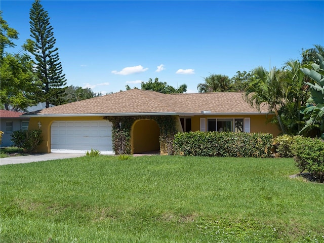 single story home featuring a front yard and a garage