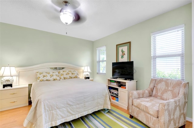 bedroom featuring ceiling fan and light hardwood / wood-style floors