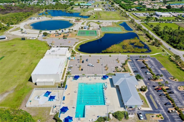 birds eye view of property with a water view