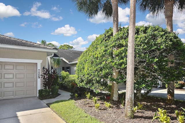 view of side of home with a garage