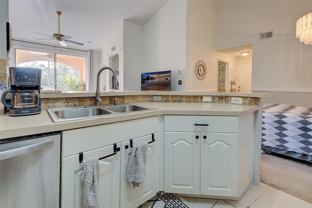 kitchen featuring ceiling fan, sink, kitchen peninsula, white cabinetry, and dishwasher