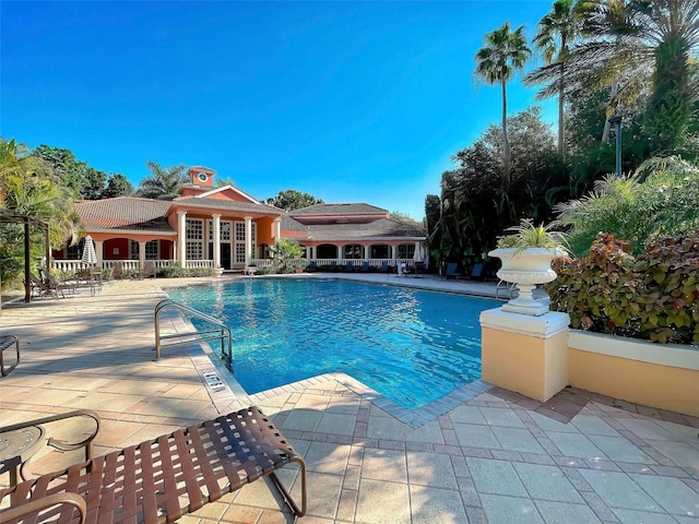 view of swimming pool with a patio