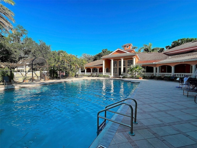 view of swimming pool with a patio