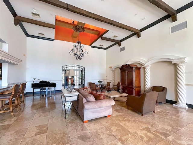 living room featuring a high ceiling, decorative columns, and beamed ceiling