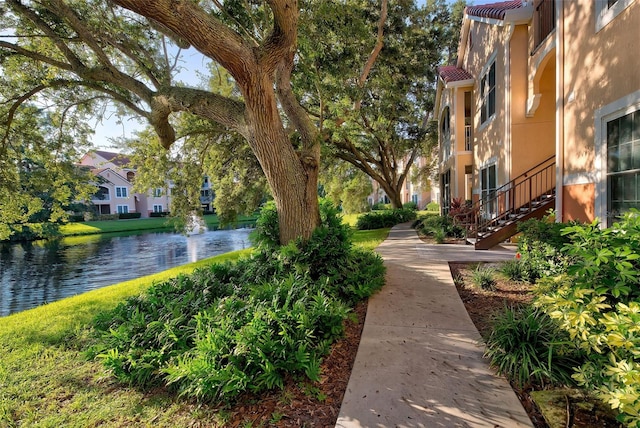 view of home's community with a water view