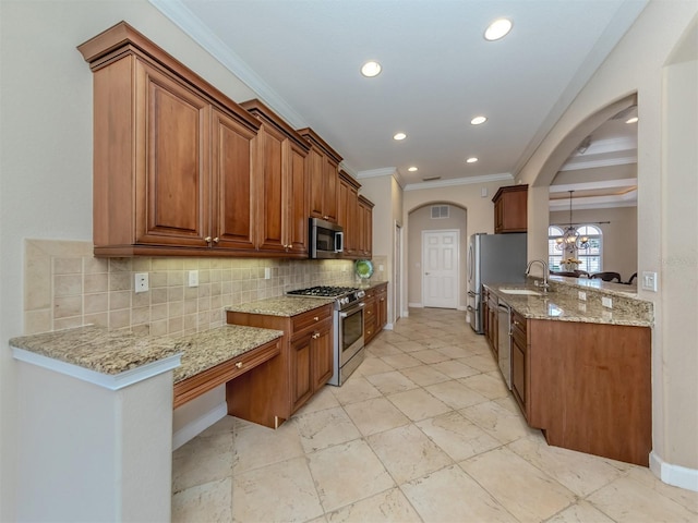 kitchen with light stone countertops, appliances with stainless steel finishes, backsplash, crown molding, and sink