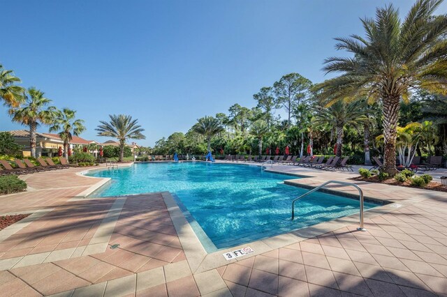 view of swimming pool featuring a patio