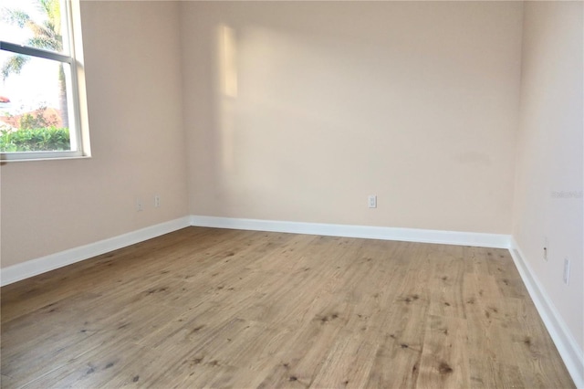 spare room with light hardwood / wood-style floors