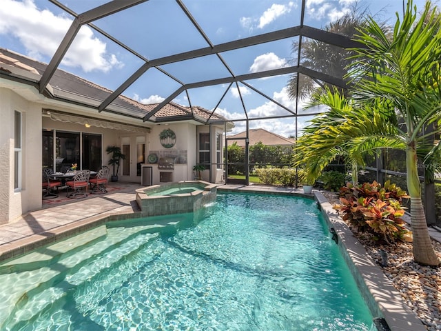 view of pool with a lanai, an in ground hot tub, pool water feature, and a patio