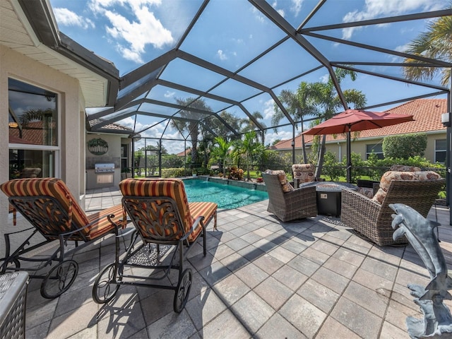 view of patio featuring a grill and a lanai