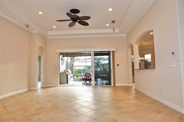 spare room with ceiling fan with notable chandelier and crown molding