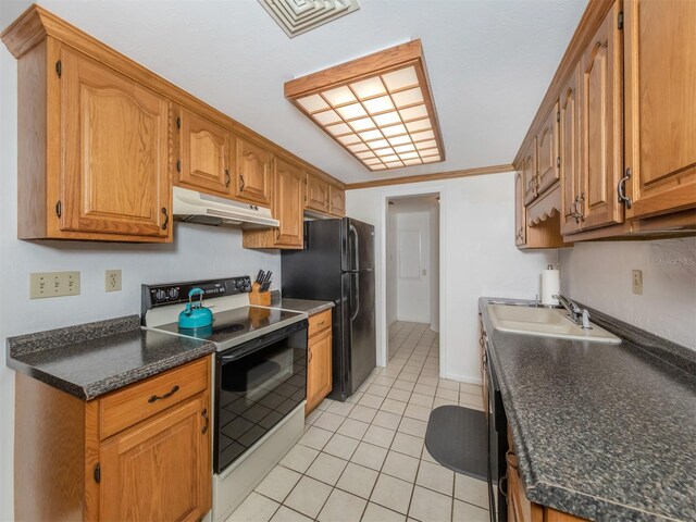 kitchen with light tile patterned flooring, sink, electric stove, crown molding, and black refrigerator