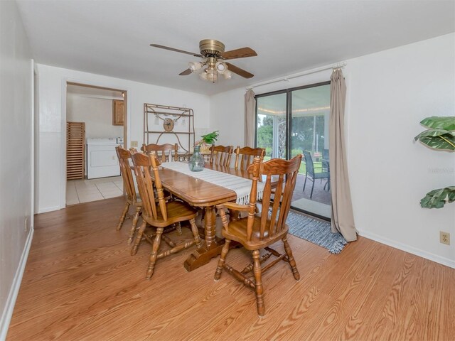 dining area with ceiling fan, washer / clothes dryer, and light hardwood / wood-style floors