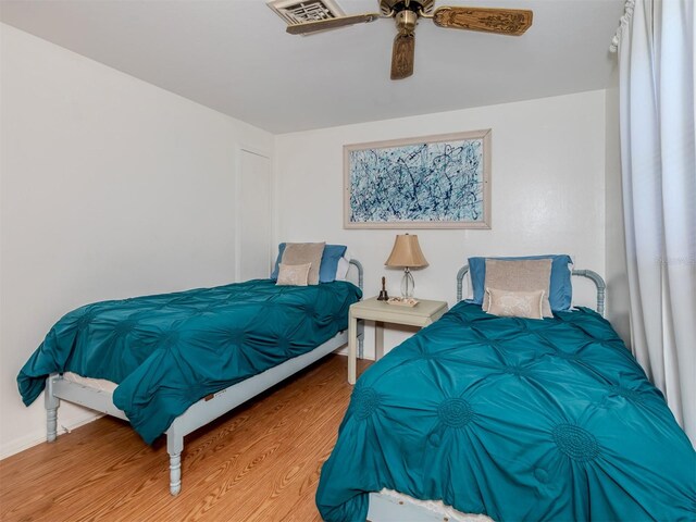 bedroom featuring ceiling fan and hardwood / wood-style flooring