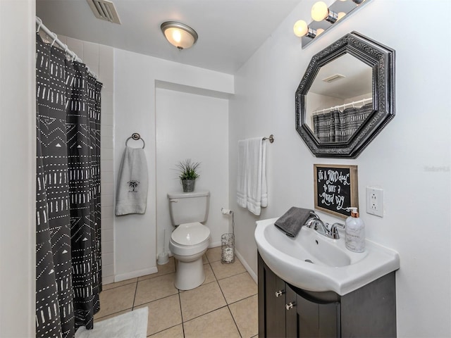 bathroom featuring vanity, tile patterned flooring, toilet, and curtained shower