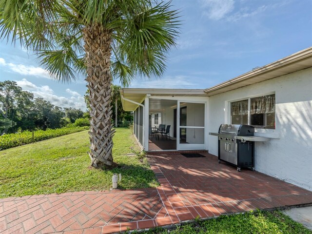 exterior space featuring a patio and a yard