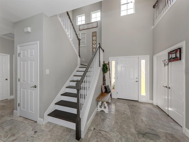 entryway with a high ceiling