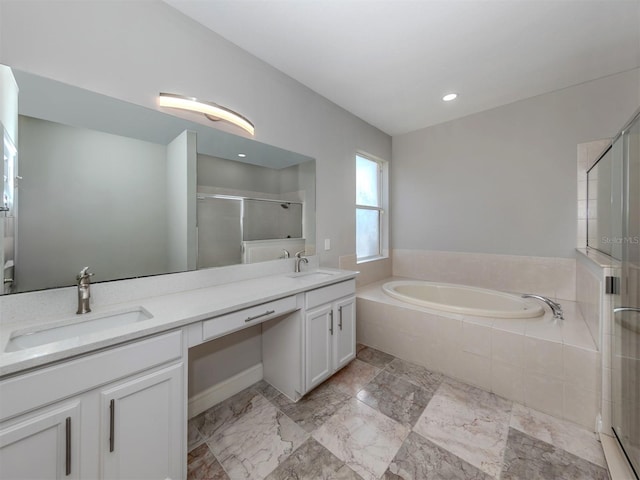 2585 Hobblebrush Dr, North Port, FL 34289 - bathroom with double vanity, a sink, a stall shower, and a bath