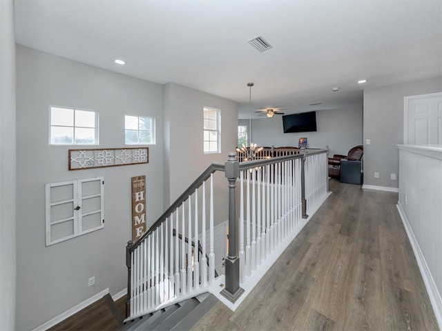 hall with wood-type flooring