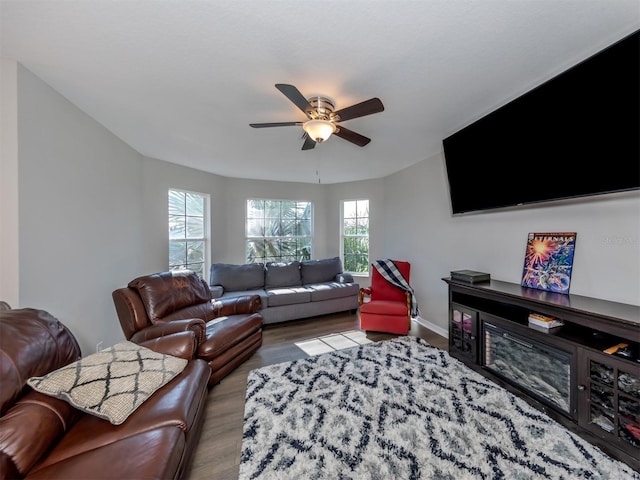 living room featuring light wood-type flooring and ceiling fan