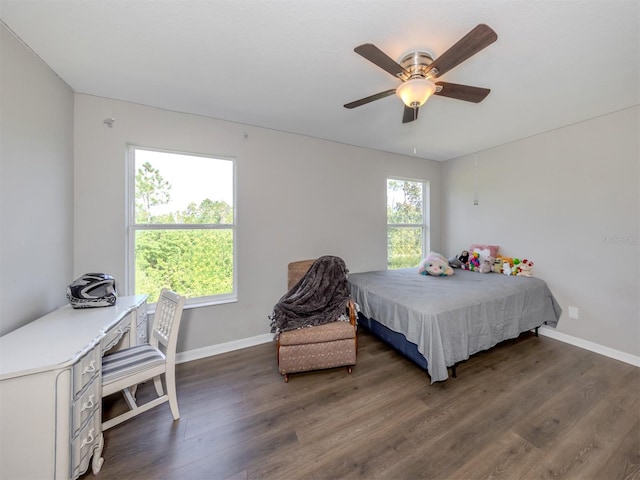 bedroom with ceiling fan and dark hardwood / wood-style floors