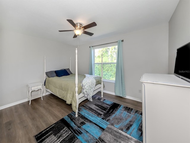 bedroom featuring dark hardwood / wood-style flooring and ceiling fan