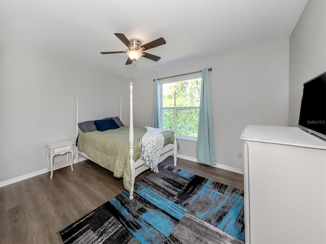2585 Hobblebrush Dr, North Port, FL 34289 - bedroom featuring dark wood-style floors, ceiling fan, and baseboards