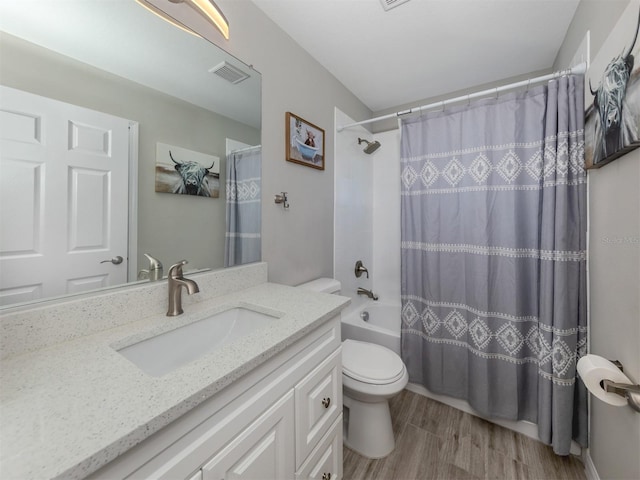 2585 Hobblebrush Dr, North Port, FL 34289 - bathroom with shower / bath combo, visible vents, toilet, wood finished floors, and vanity