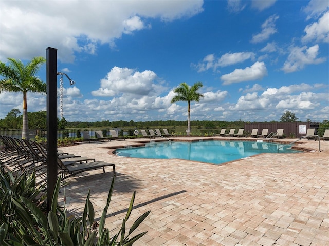 2585 Hobblebrush Dr, North Port, FL 34289 - community pool featuring fence and a patio area