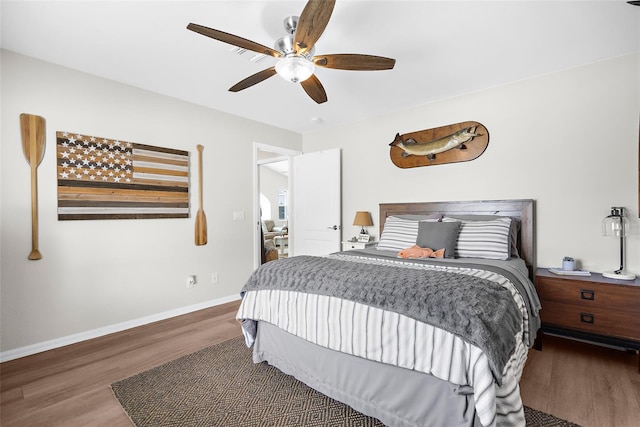 bedroom featuring ceiling fan and dark wood-type flooring