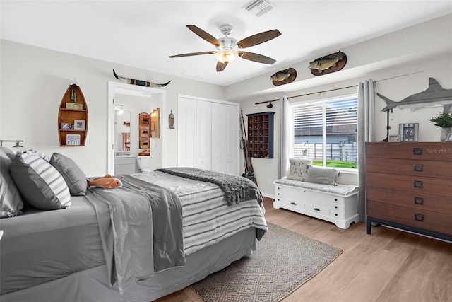 bedroom featuring a closet, light wood-type flooring, and ceiling fan