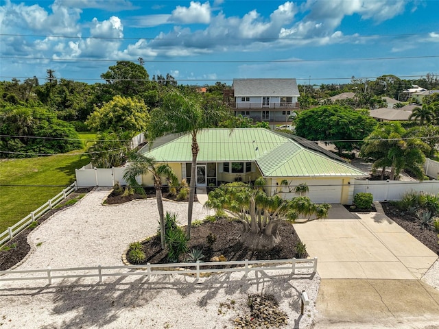 view of front of property featuring a garage and a front lawn