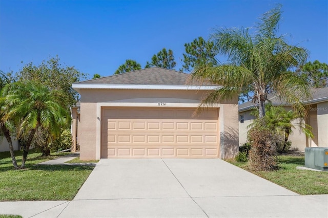 view of front facade featuring a front lawn and a garage