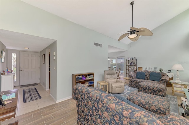 living room with vaulted ceiling and ceiling fan