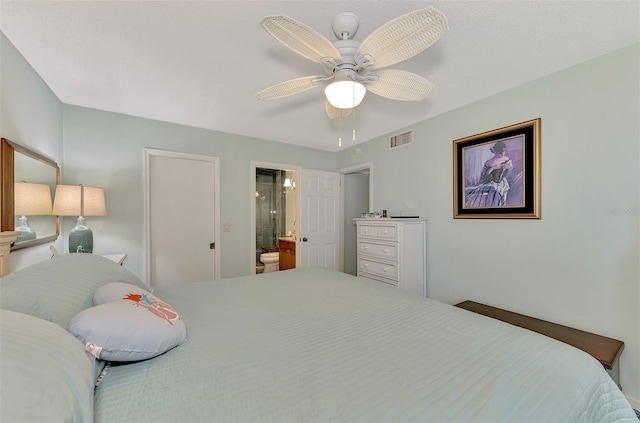 bedroom with ceiling fan and ensuite bathroom