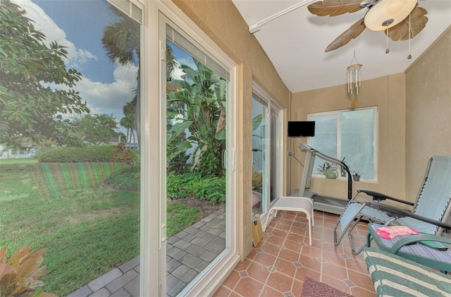 sunroom featuring ceiling fan