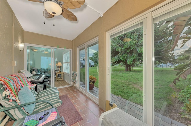 sunroom featuring ceiling fan