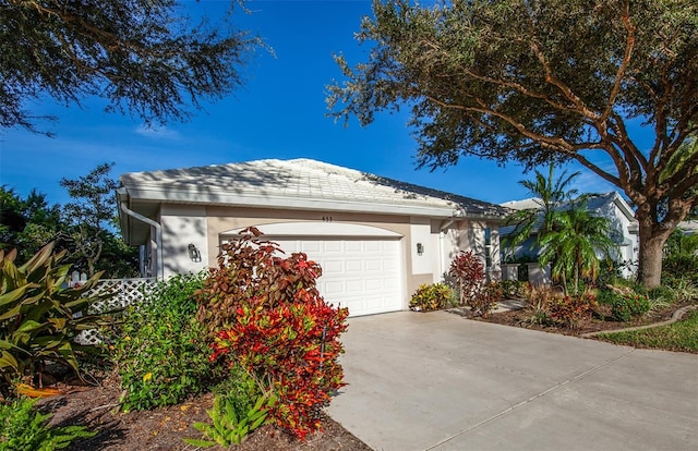 ranch-style house featuring a garage